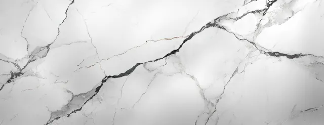 Polished white marble surface with grey veined pattern, glossy close-up background