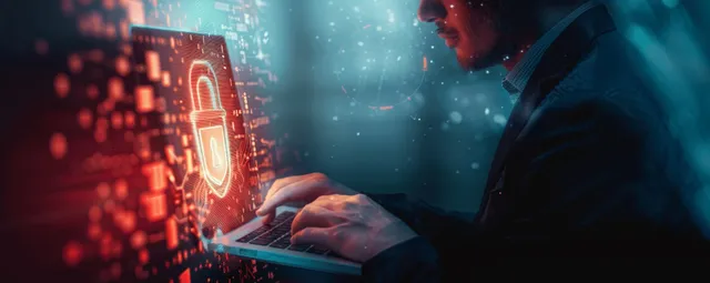 Businessman using laptop beside glowing digital padlock for cybersecurity with Data Protection