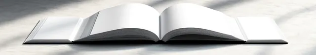 Open blank book lies on light marble with soft natural light and gentle shadows.