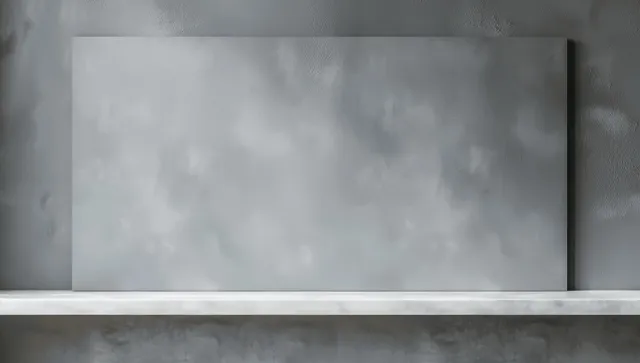 Blank white banner on grey wall above empty tabletop display shelf mockup