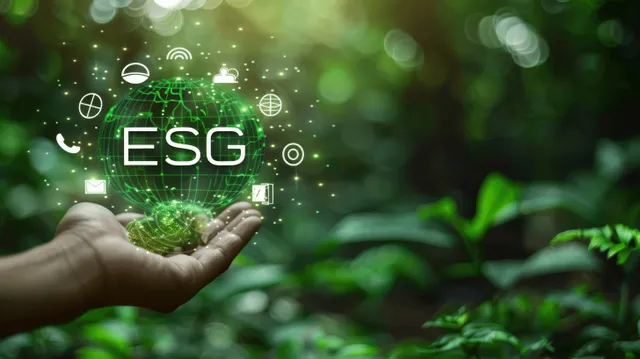 A hand holds a glowing ESG globe with green icons over a blurred forest background.
