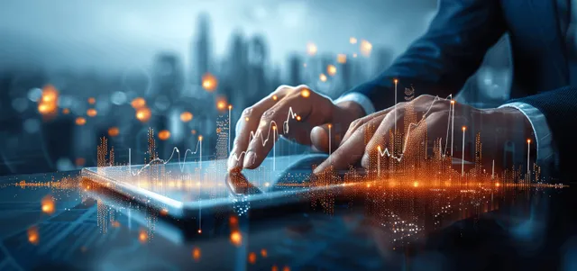 A businessman’s hands touch a tablet showing a glowing stock chart as city lights blur behind.