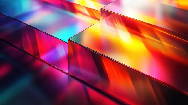 Colorful glass blocks refract light, forming a red-yellow-blue-purple gradient pattern