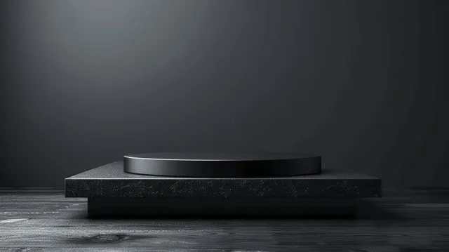 Black wooden shelf resting on a dark studio pedestal with a soft spotlight and empty background space.
