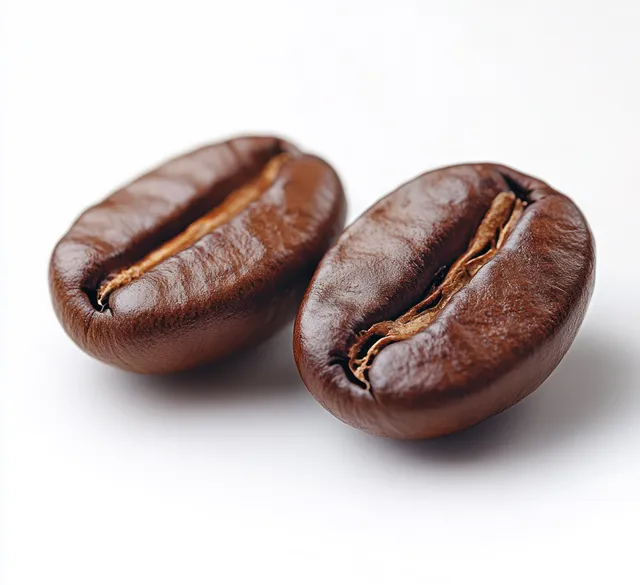 Two dark roasted coffee beans isolated on a white background with visible cracked texture and glossy highlights.