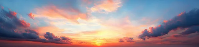 Sunrise over a cloud-filled sky with warm pink, orange, and blue light