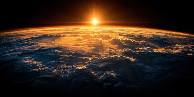 Earth from space showing Australia and New Zealand with clouds over blue ocean at twilight