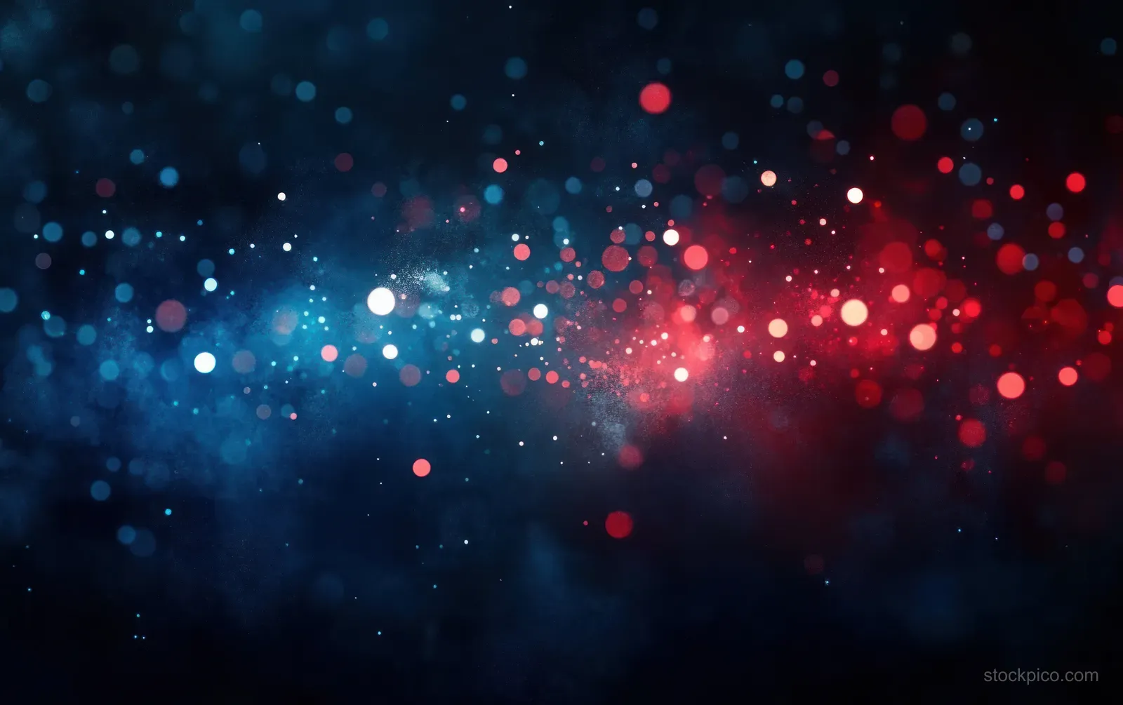 Blue and red glowing particle clusters with scattered bokeh lights float across a dark cosmic background.