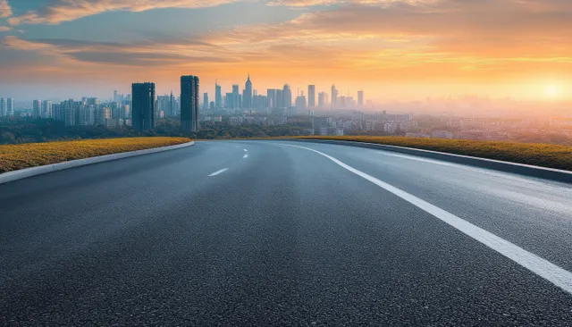 Curved Road Leading Toward Skyline at Golden Hour