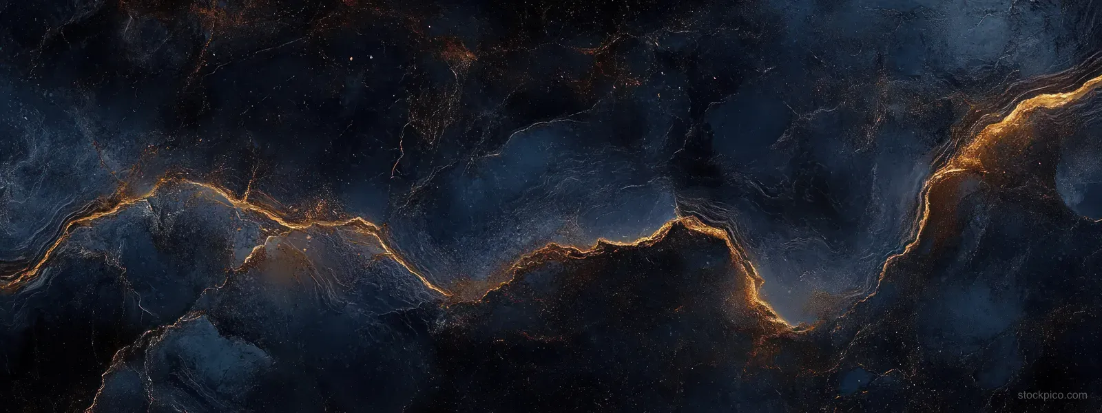 Close-up of dark navy and black marble with glowing gold vein cracks forming an abstract pattern.