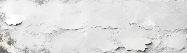 Close-up of a white marble wall texture with gray grunge swirls and visible cracked patches.