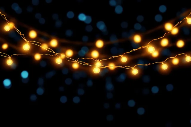 Yellow string lights glow across a dark background with blue bokeh circles behind them.