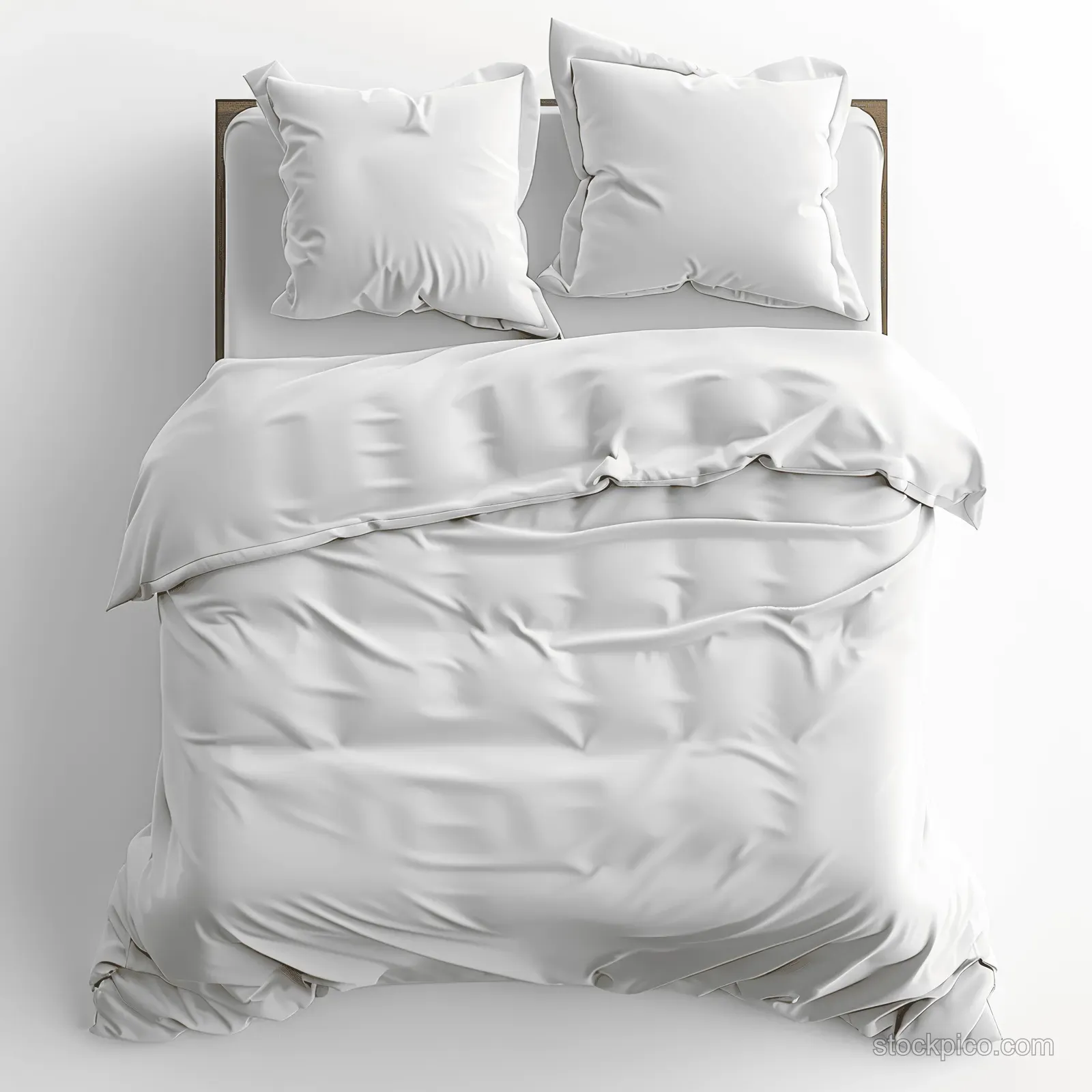 Two white pillows and a neatly made duvet on a tidy bed against a simple headboard.