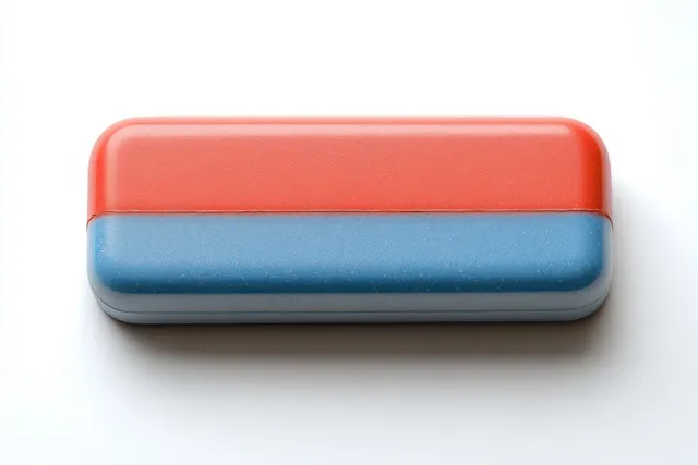A two-tone rectangular eraser with red and blue halves placed on a clean white background.