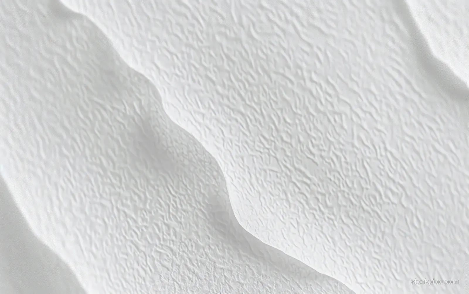 White textured surface shows gentle wave-like curves with subtle shadows and soft depth.
