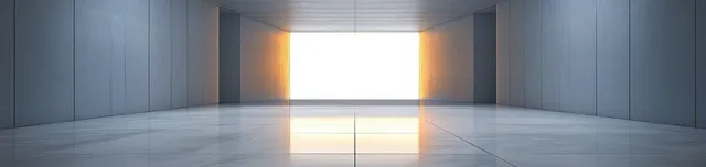 Empty minimalist interior with gray walls and polished marble floor reflecting a bright window of daylight.