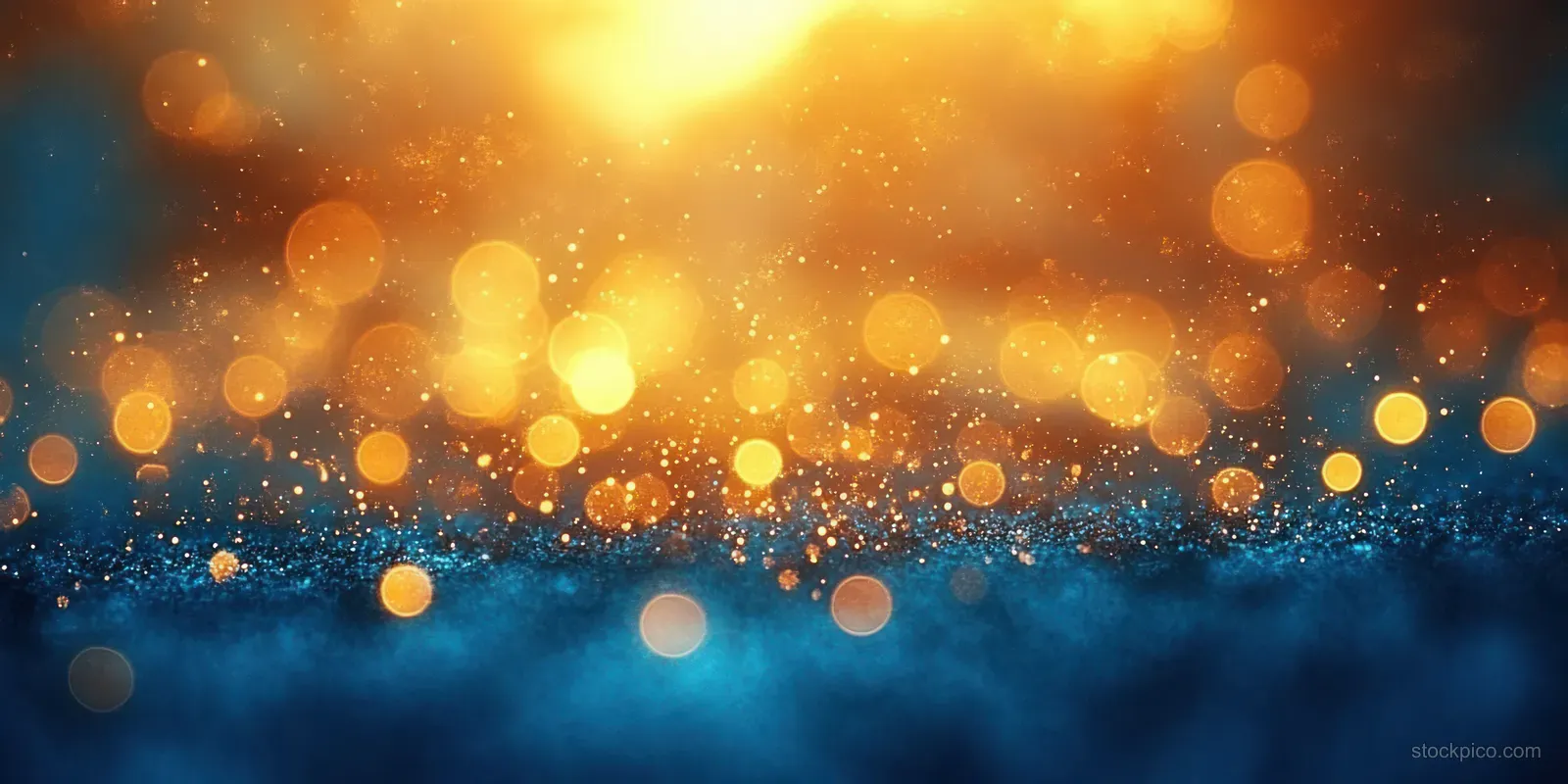 Sunlit beach sand with glowing bokeh lights above blurred blue water.