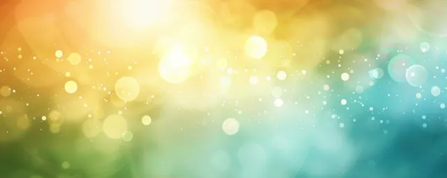 Soft glowing bokeh light orbs blending warm yellow-green into cool blue background