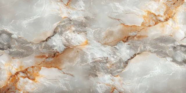Close-up marble surface with swirling white, gray, and rust-brown veins and textured natural stone detail.