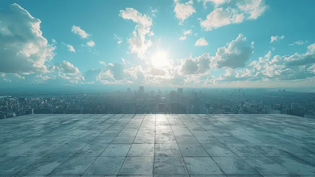 Empty rooftop terrace with concrete floor overlooking distant city skyline and blue clouds
