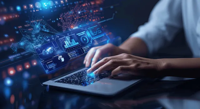 A business analyst’s hands type on a laptop while a glowing virtual dashboard shows sales charts and KPIs.