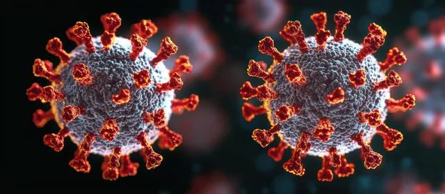 Microscopic coronavirus particles with red spike proteins floating against dark background