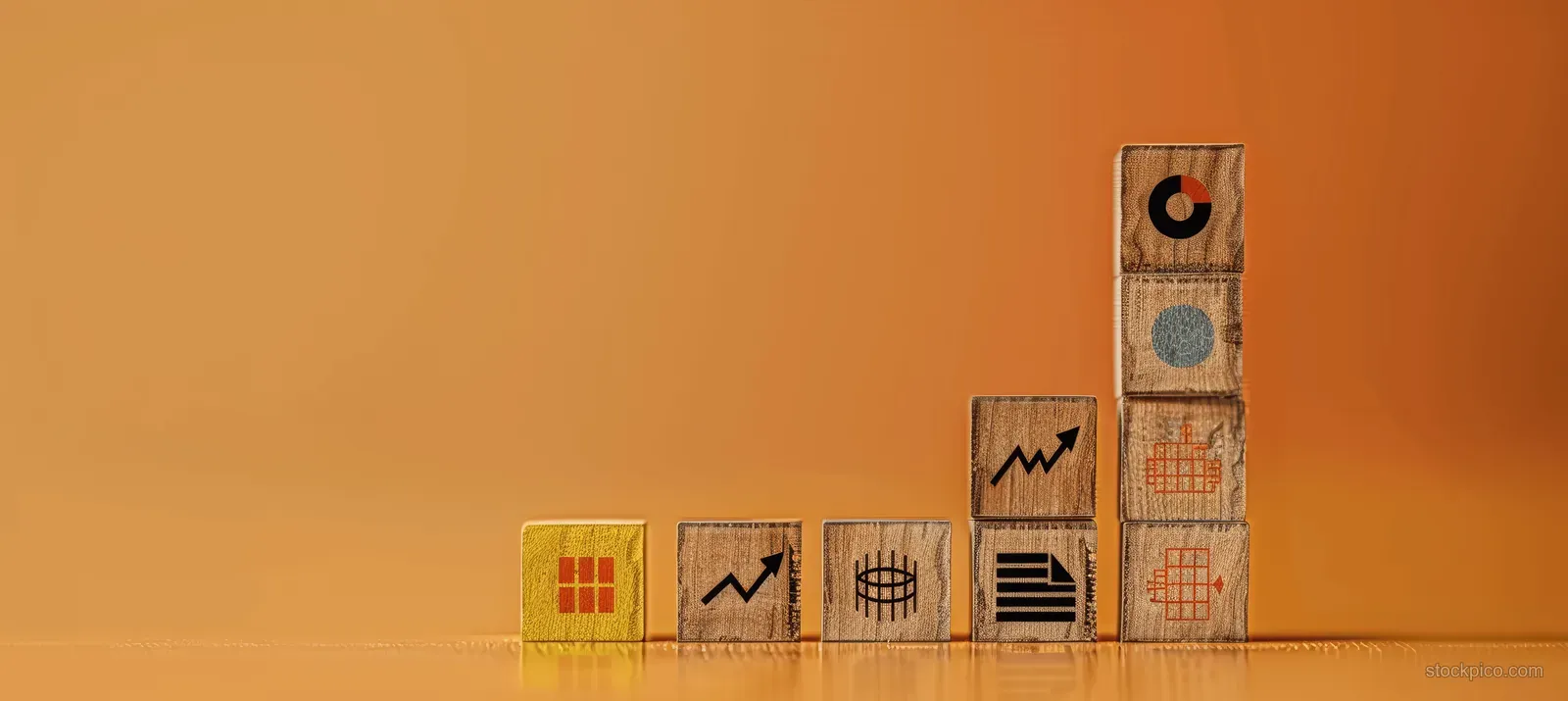 Wooden blocks with arrow up and target icons are stacked on a pastel orange background.