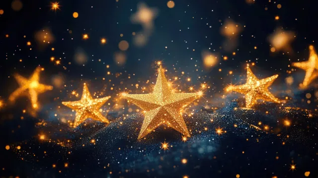 Golden glittering stars glowing on a dark sparkling surface surrounded by warm light bokeh.