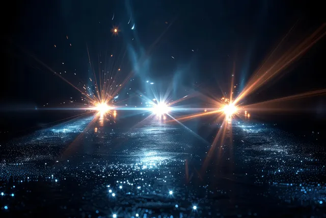Three blue lens flare beams burst across black horizontal space with glowing particles