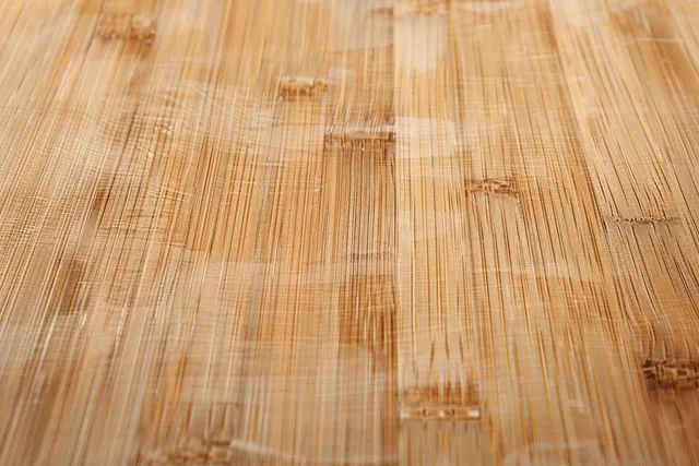 Bamboo wood grain texture background viewed from above on a light natural desk surface