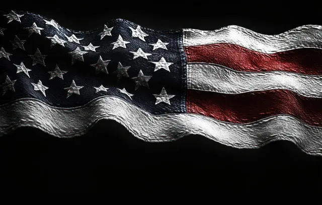 Close-up of wavy textured American flag fabric with stars and stripes against a dark backdrop