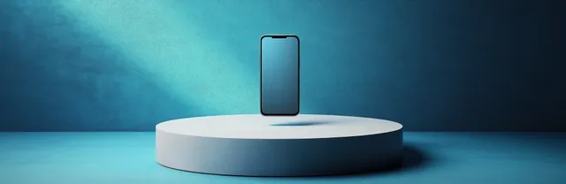 Black smartphone standing on circular pedestal against textured blue wall with dramatic spotlight