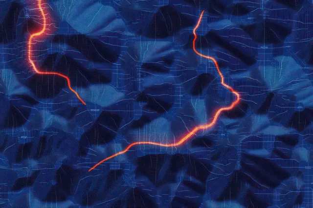Mapa topográfico azul del terreno con rutas rojo anaranjadas brillantes que serpentean entre valles montañosos y líneas de contorno.