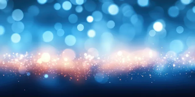 Blue bokeh beach background with glowing sunlight specks and dreamy blurred lights