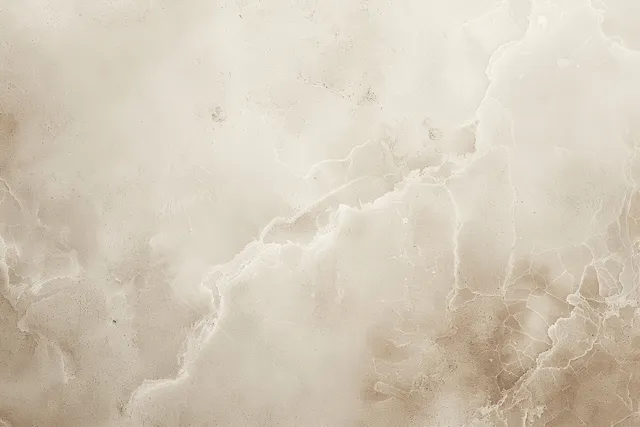 Beige marble texture with pale veining over a lightly grungy, textured paper background.