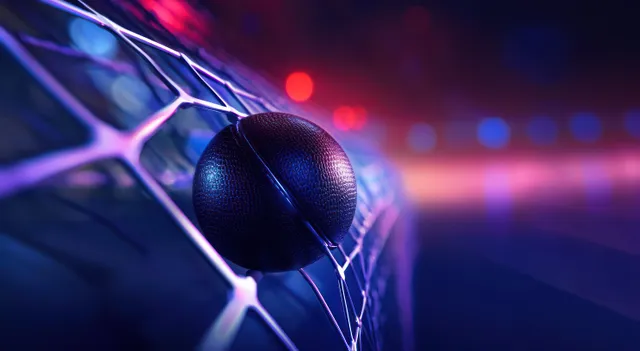 A glowing hockey puck rests in an illuminated goal net under dramatic blue and purple rink lighting.
