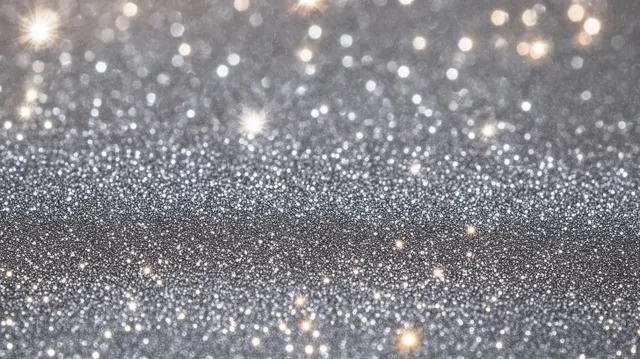 Silver glitter particles shimmer across a dark background with soft glowing bokeh lights