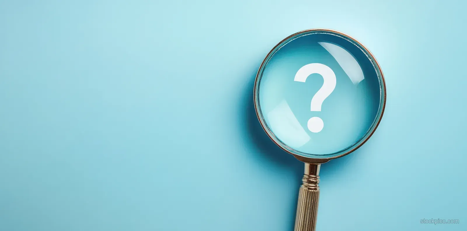 A magnifying glass enlarges a white question mark on a light blue background.