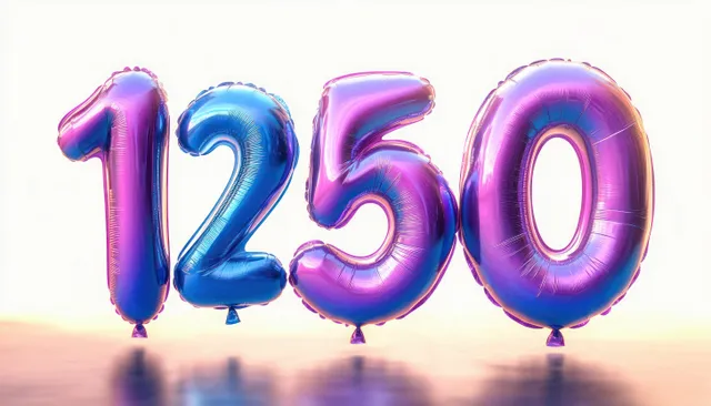 Metallic number balloons shaped 1, 2, 5, and 0 lined on a reflective surface with light background.