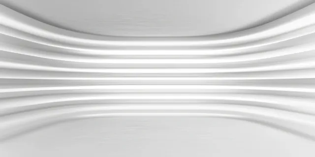 Minimalist white interior with smooth curved horizontal wall layers and soft lighting.