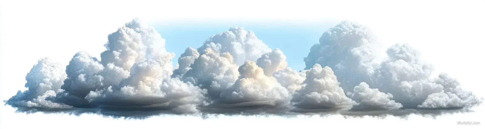Large fluffy white clouds float across a pale blue sky with soft shadows.
