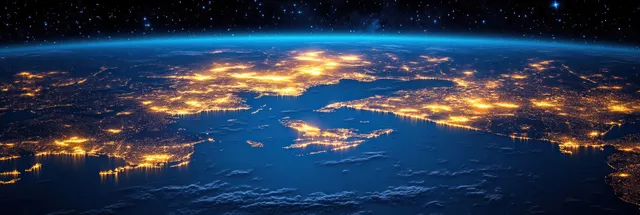 Aerial night panorama over Great Lakes with city lights glowing on dark water and shoreline
