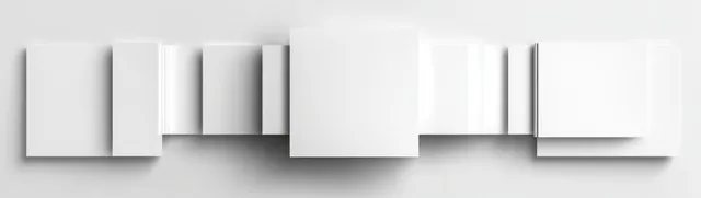 Stacked blank A4 paper sheets in natural window light with soft shadows
