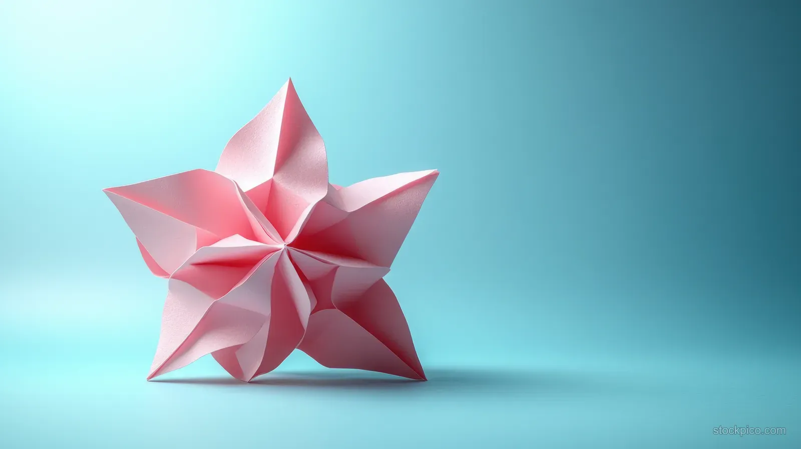 A faceted pink geometric star sculpture floats on a light blue gradient background with soft highlights and shadow.