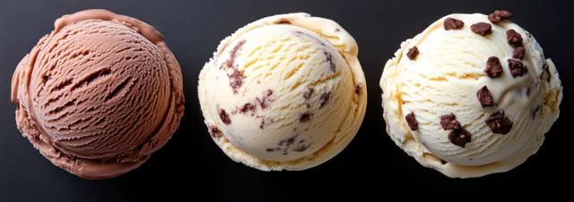 Three ice cream scoops in a row on dark background, chocolate and vanilla textures
