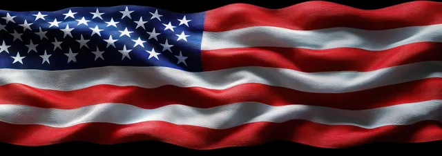 Waving American flag close-up showing star field and red and white striped fabric texture under dramatic light.