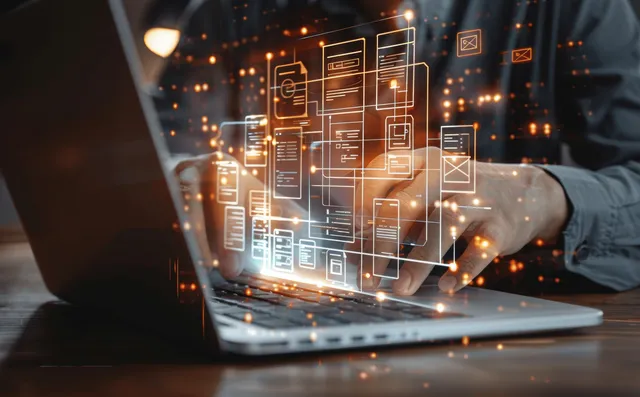 A person works on a laptop with glowing holographic document icons showing a digital filing workflow.