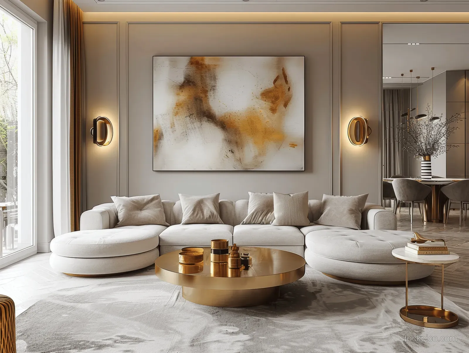 Beige sectional sofa and round gold coffee table in a Scandinavian living room with abstract art on gray paneling.