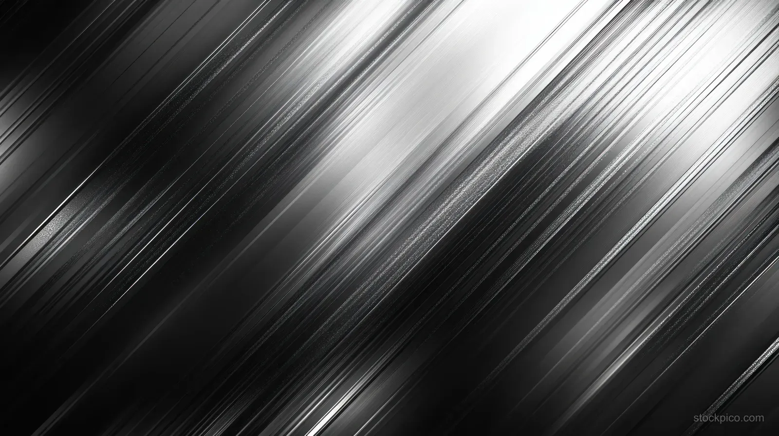 A diagonal grooved brushed metal surface with dark tones and silver highlights fills the frame.