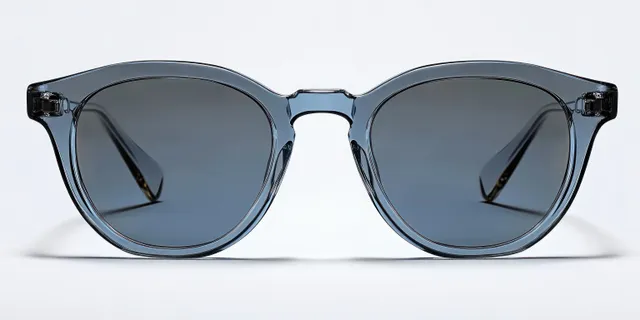 Close-up of smoky blue transparent sunglasses with dark lenses on a white surface